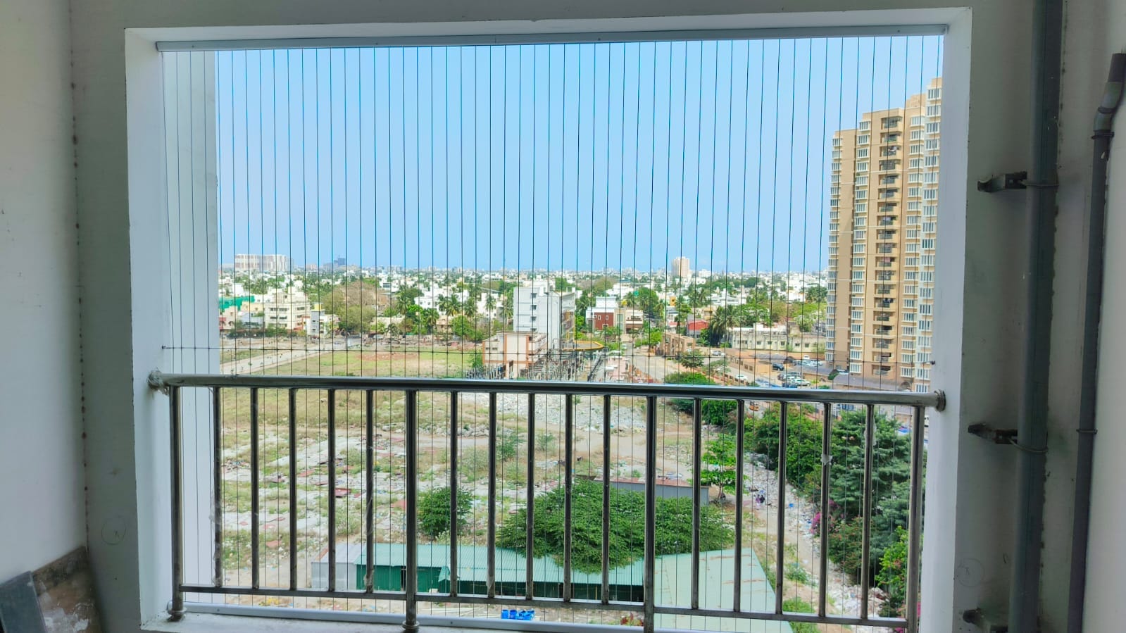 Horizontal cable invisible grills fitted to a residential balcony railing