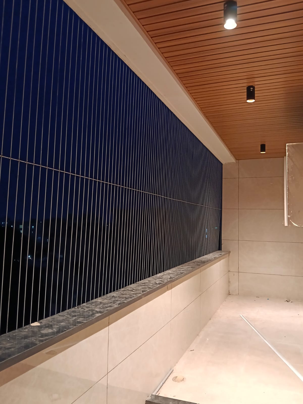 Villa balcony invisible grills on a large verandah in Chennai